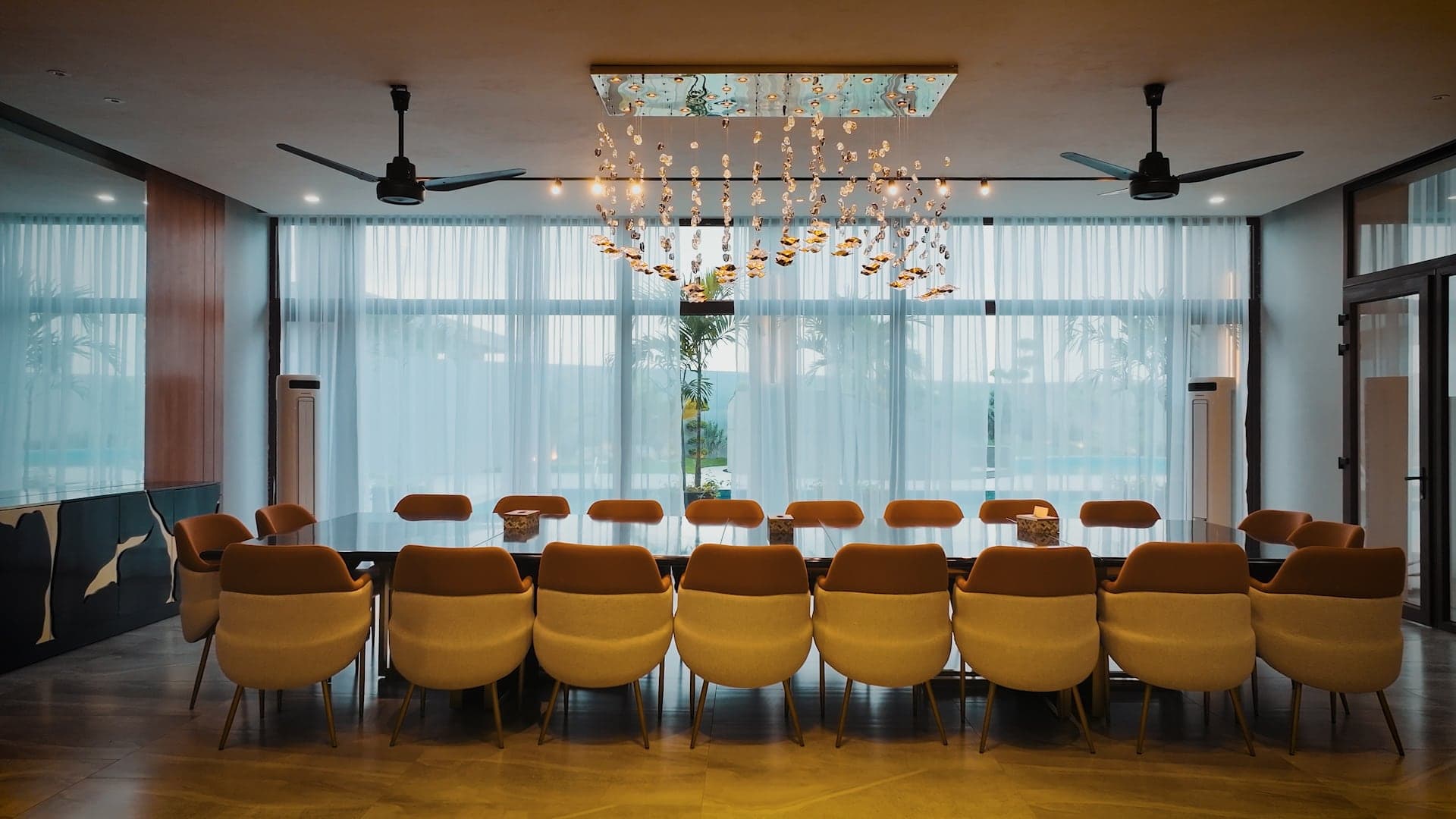 Luxury dining hall with a cascading crystal chandelier and show-kitchen at FHU Resorts Karachi